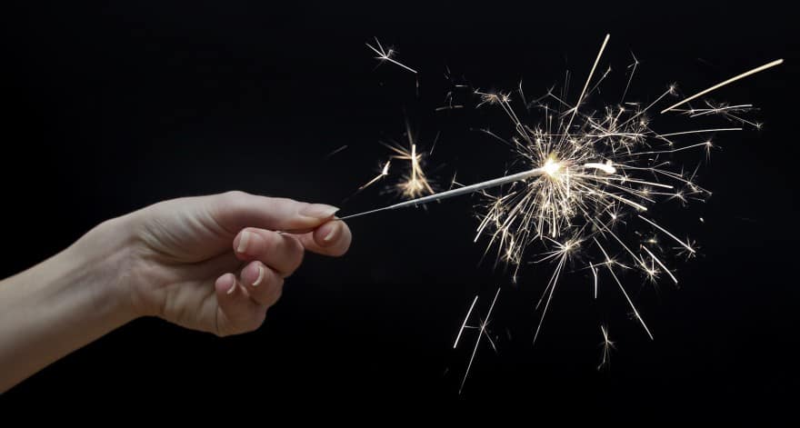woman's hand holding a sparkler